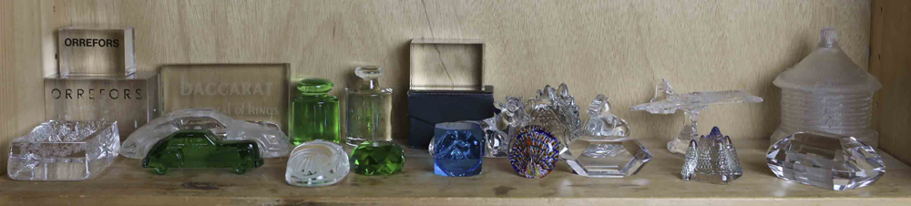 One shelf of paperweights, including (2) Orrefors and (1) Baccarat retail weight; a Tiffany & Co.