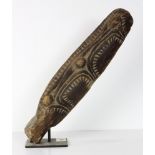 Papua New Guinea carved wood canoe prow, formed as a crocodile, rising on a custom stand, 1'8''l