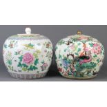 (lot of 2) Chinese enameled lidded porcelain jars: one with phoenix and peonies; together with