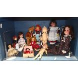 One shelf of mostly miniature dolls, consisting of Japan and German made bisque head dolls by