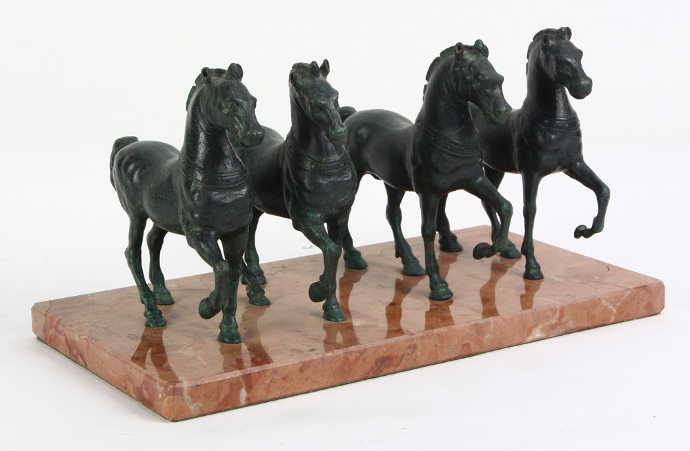 Archaistic style patinated figural horses, mounted on a marble plinth, 6