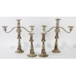 (lot of 4) Suite Continental Rococo silver three light candelabra and matching candlesticks