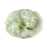 A Chinese pale jade carving of a recumbent ox and chilong, 1" h,