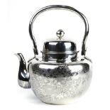 Japanese silver tea kettle decorated with chrysanthemums, 9.5 ht with extended handle