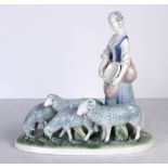 Gerald Porcelain figural group depicting a provincial girl feeding sheep
