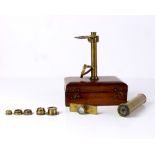 Brass traveling microscope, rising on a hinged lid wooden box