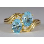 Blue topaz, diamond, 14k yellow gold ring