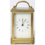 French carriage clock, the rectangular brass case fitted with beveled glass panels