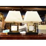 A Pair of Robert Abbey brass table lamps