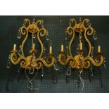 A pair of custom wall sconces