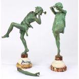 A pair of patinated metal figures
