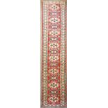 An Uzbek Kazak runner 2'8" x 19'3"