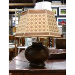 An Arts and Crafts style hammered copper table lamp