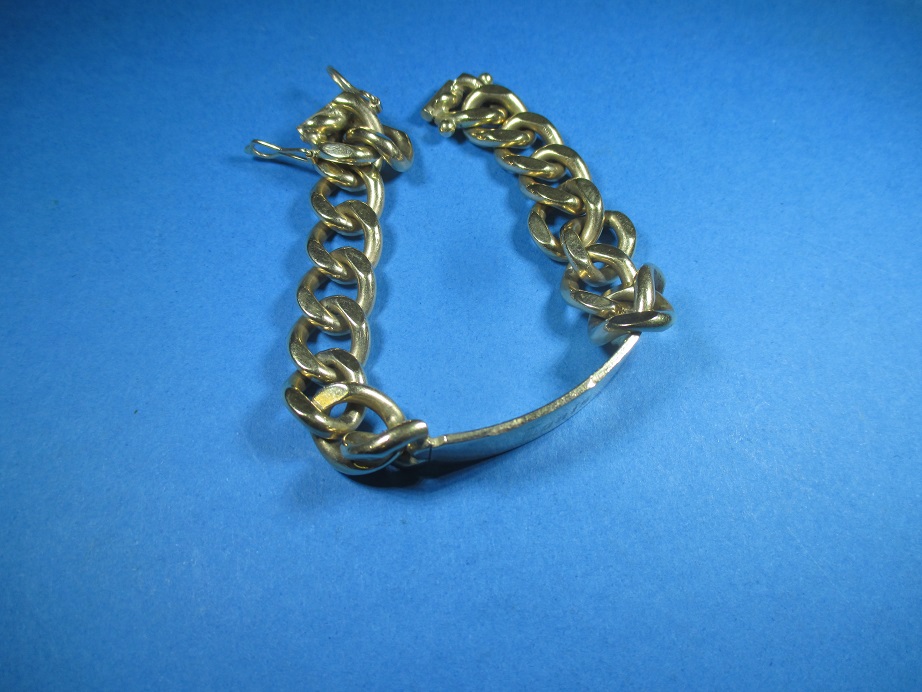 A heavy 9ct gold identity bracelet , approx. weight 56.9g