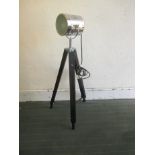 A modern industrial style lamp on tripod stand