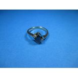 A 14ct yellow gold and diamond ring with central blue stone, ring size L ½