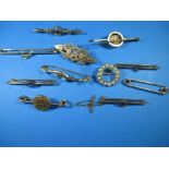 A collection of Edwardian gold and yellow metal bar brooches, approx. total weight 30g