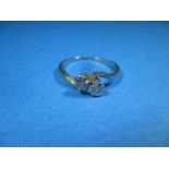 An 18ct white gold 2 stone diamond cross-over ring, approx. size O