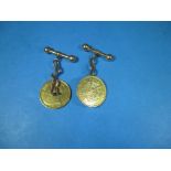 A pair of cufflinks made from 1896 African half pond coins