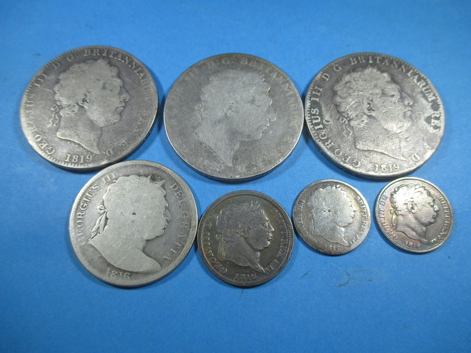 A quantity of George III silver coins to include Crowns