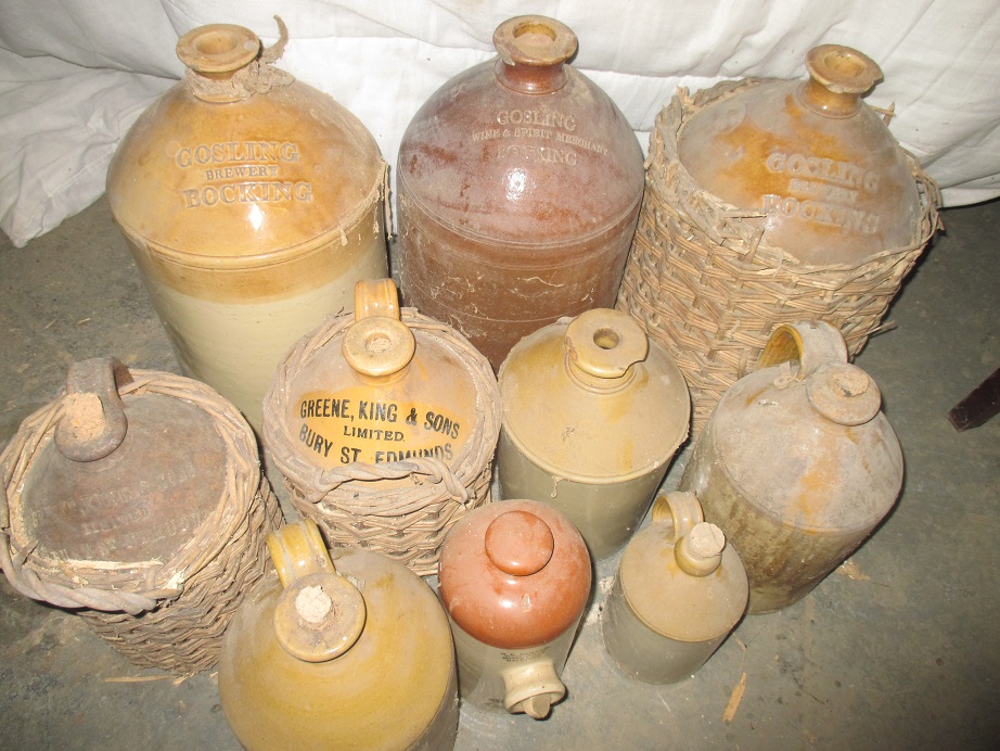 A large quantity of stoneware jars, several with local names