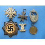 A quantity of WWII German military badges brought back by a soldier at the end of the war