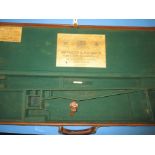 A cloth and leather shot gun hard case with Holland & Holland label