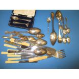 A quantity of cutlery to include approx 200g of silver items