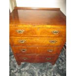 A small chest of 4 straight drawers