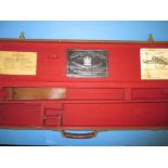 A leather shot gun case for a Holland & Holland Royal hammerless ejector gun