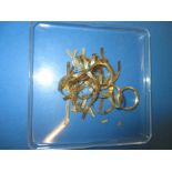 A quantity of scrap 9ct gold items, approx. weight 16g