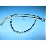 An 18ct gold necklace and bracelet set with cabucheon Lapis, approx weight 44g