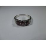 A 9ct white gold ring set with rubellite and diamonds, approx size P