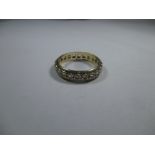 A 9ct gold wedding band set with semi-precious stones, approx ring size P