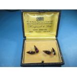 A pair of Indian gold and purple tinted garnet cufflinks, with original purchase receipt dated 1945