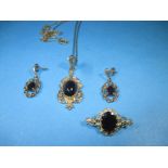 A 9ct gold Garnet necklace, earring and brooch set