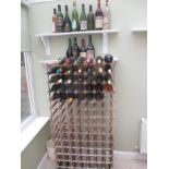 Wine rack and contents of wines, sherry and cognac. Register and bid at https://