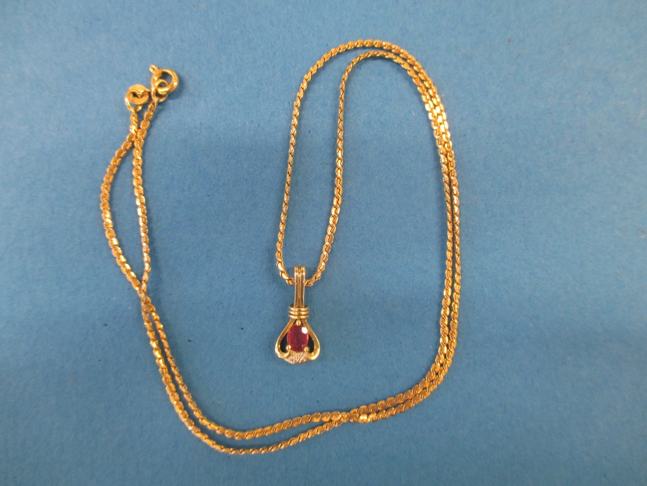 A 9ct gold necklace chain and a pendant set with diamonds marked 585