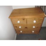 A small waxed pine chest of drawers