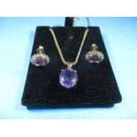 A 9ct gold fox tail necklace chain with Amethyst set pendant and matching earrin