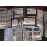 A quantity of Royal mail first day covers and several albums of tea cards