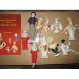 A quantity of china half dolls to include an art deco example