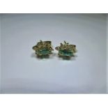 A pair of 9ct gold diamond and emerald earrings