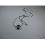 A 9ct white gold necklace with amethyst set pendant