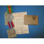 A duo of WWII medals to Mrs P A Cocks