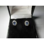 A pair of sapphire and diamond ear studs