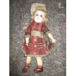 An early 20th century tete Jumeau doll. Register and bid at https://clareauctio