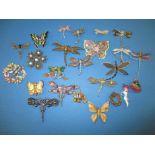 A quantity of vintage costume jewellery brooches one concealing a fob watch