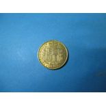 An 1872 shield back gold sovereign