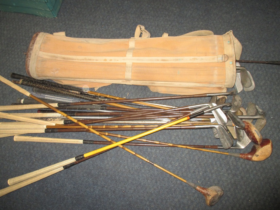A large quantity of vintage golf clubs and bag to include left handed example